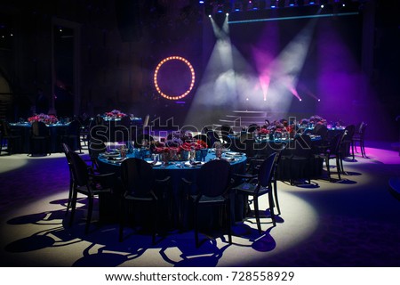 Tables sets for wedding or another catered event dinner. Royalty-Free Stock Photo #728558929