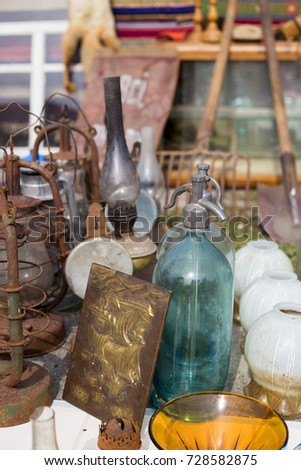 Blue glass bottles and jars at a flea market