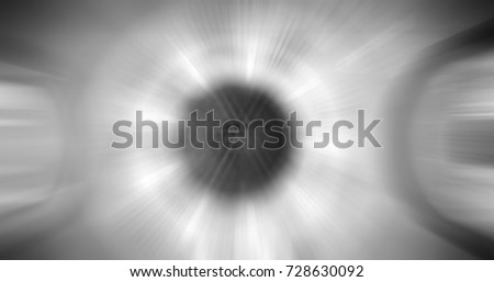 monochrome zoom blurred abstract background of power sonic wave loud sound with light flashing out of speaker in center, black and white blurry backdrop for text copy space
