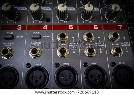 Detail of audio mixing console board with Knobs, Jack hole and Mic connector 