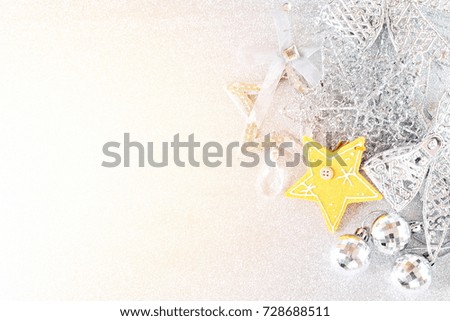 Happy New Year, Merry Christmas, celebration or holiday background concept : Yellow star and shiny silver ornaments on bright abstract background bokeh, Top view or flat lay with copy space