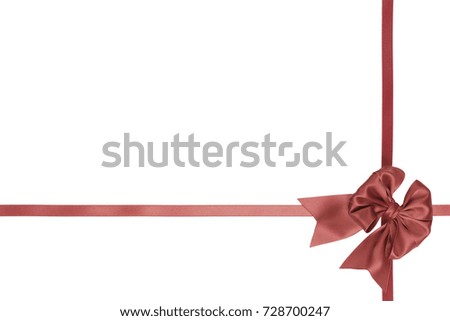 Single Christmas beautiful bow, cross ribbon, coral color, on white background