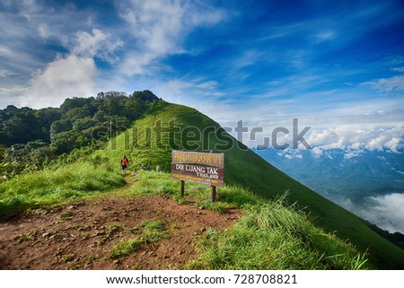 HDR Effect of beautiful mountain at Doi Luang Tak, Tak Province,Thailand (Thai language on wooden sign is Doi Luang Tak Thailand). subject is blurred.