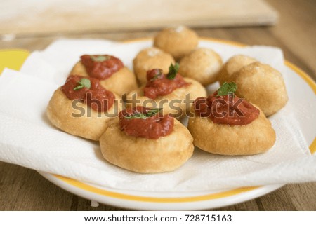 deep-fried starters traditional of sicily called frittelle al pomodoro