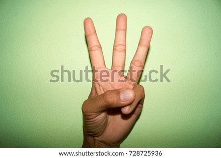 Sign language on green background.
