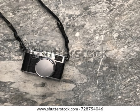 Vintage camera on Marble pattern background with copy space.