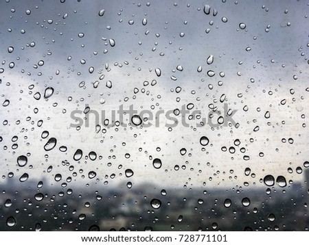 The rain drop on the glass of window.