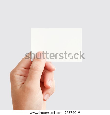 Businessman's hand holding blank white paper business card, closeup isolated on square gray background