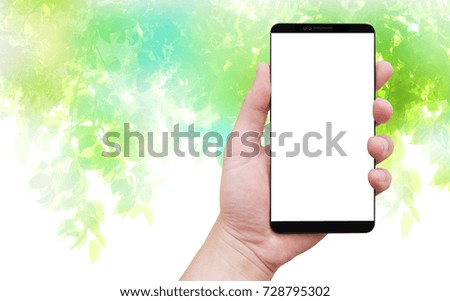 holding smart phone green background