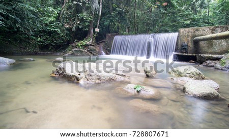 Long exposure of water stream in the river at Sungai Liam, Ulu Yam Selangor Malaysia. Image contain excessively noise/sharp or blur due to long exposure.
