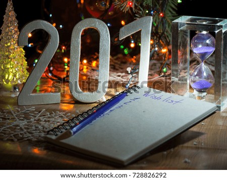 2018 new year. wooden numerals with sandglass new year goals