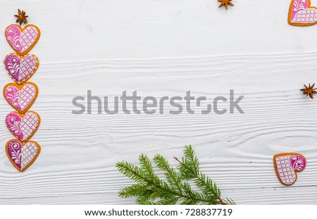 Christmas background with decorations, gingerbread, spices on old rustic white wooden board, top view, copy space