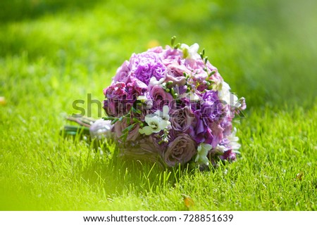 Wedding Bridal party bouquet lies on the surface