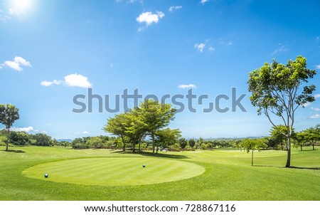 golf course with blue sky background.