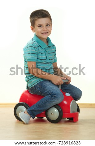 Young boy with toy car