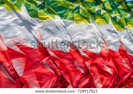 Texture, background, pattern. Flags waving in the wind. Decoration of City Boulevards