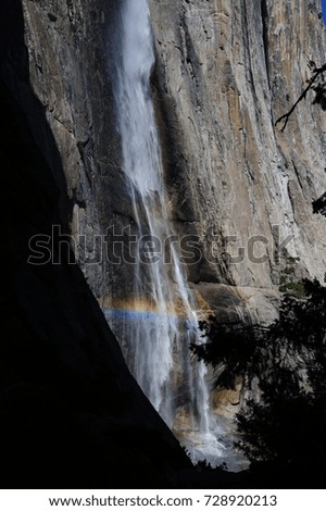 A rainbow cast by the upper Yosemite Falls. Yosemite National Park, California, USA