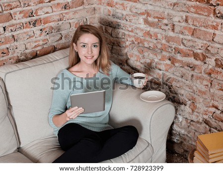 Happy woman with digital tablet