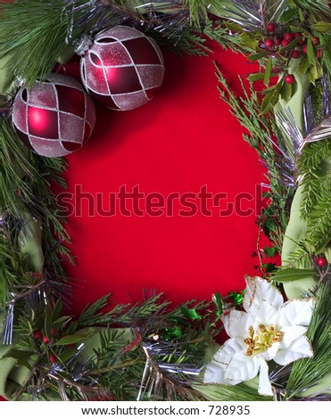 empty christmas frame on red background with poinsettia holly and red ornaments (vertical)