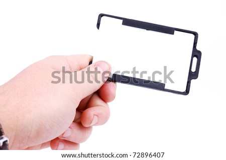 badge in a hand on a white background