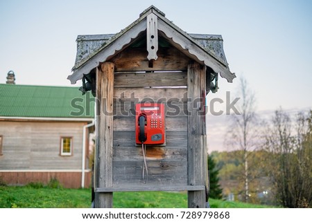 a modern payphone in a wooden antique box Royalty-Free Stock Photo #728979868