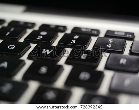 Black Laptop Keyboard on silver background 