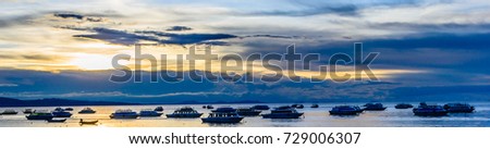Boats on Titicaca  Lake at the sunset, silence , wide format