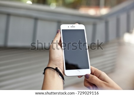 Hands holding a cellphone