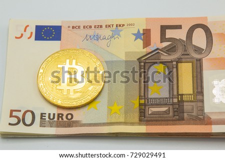 Golden bitcoin on euro banknotes background. Bitcoin cryptocurrency. Blockchain technology, digital money, Mining concept.