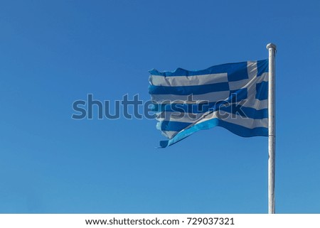 Greek flag with blue sky.