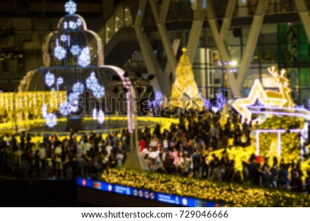 Blurred - Bangkok Thailand, Merry - Xmas - Christmas tree in the garden at Department store  At night. A lot of people take pictures and happy.