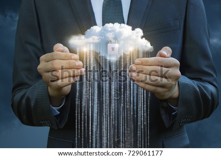 Business man protects the flow of information from the cloud.
