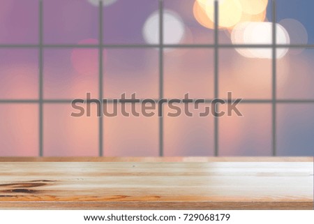 Wooden desk with Blurred light bokeh abstract background.
