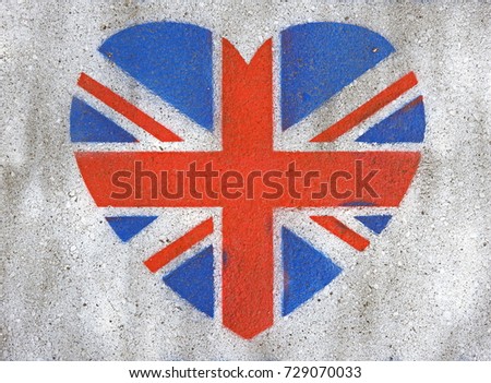 British flag in the form of a heart on a white wall.
