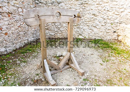 Old wooden pillory on the castle Pilcza in Smolen (Poland)