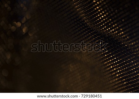 Gold festive background - close up picture of a sparkly fabric. 
