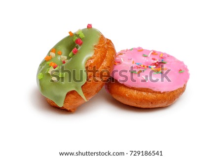 Pink and  green frosting doughnut  on a white background