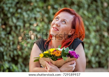 A happy attractive Millennial Caucasian young woman with red hair holding a flower bouquet with a romantic look. Romance, love story concept, first date, romantic mood, in love illustration. 