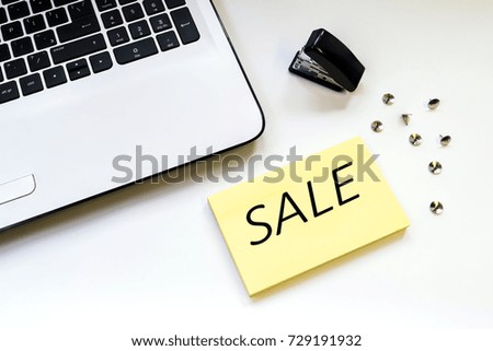 Yellow stickers on the table with an inscription discount on a white background