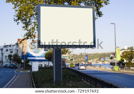 horizontal blank billboard on the city street in background buildings and road with cars mock up