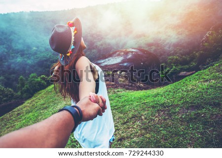 Lover women and men asians travel relax in the holiday. Hold hands running on the lawn. Wild nature wood on the mountain.   Royalty-Free Stock Photo #729244330