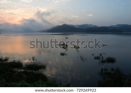 A photographer who takes pictures of the morning scene in the lake of Korea.