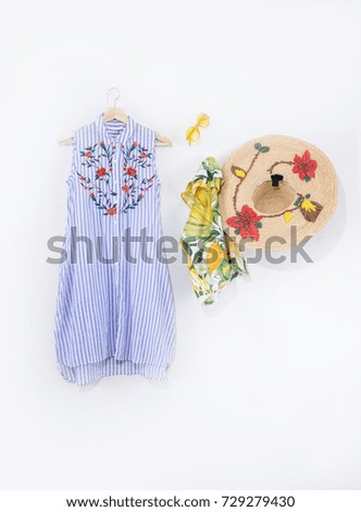 straw embroidered flowers hat with sundress ,sunglasses,scarf clothes isolated 