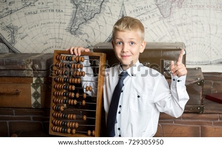 handsome boy holding big ancient wooden abacus calculation. conceptual idea about modern education system. a guy dreams of his future profession, diligent good student in school, college, university