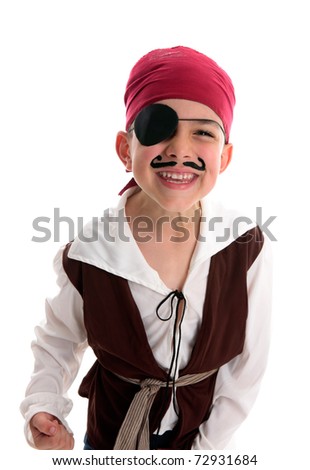 A happy young  boy wearing a pirate costume.  White background.