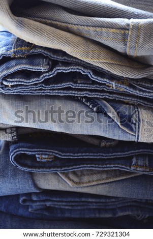 denim closet, clothing of denim fabrics of different colors and textures, a classic trend in clothing, classic denim