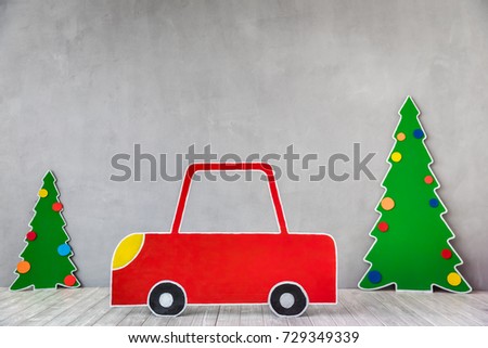 Cardboard car and Christmas tree. Xmas holiday concept