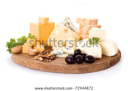 cheese board with delicous cheeses, walnuts and black olives Royalty-Free Stock Photo #72944872