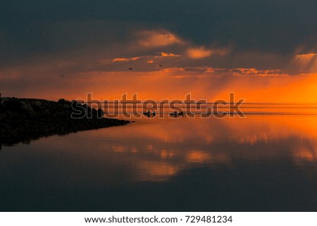 Silhouette of Boaters on Water 