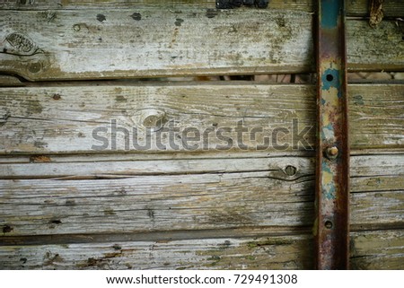steam punk wooden background of boards fastened with a metal belt